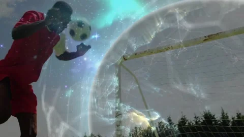 Striker shifting weight, running heading ball into net, CGI globe sweeping for Stock Footage 330563947