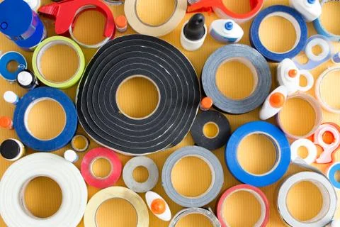 Striking abstract pattern of glue pots and tape Stock Photos