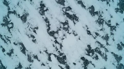 A striking abstract top-down drone photograph looking straight down at the te Foto stock