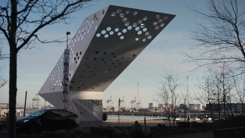 Striking Angular Building With A Perforated Facade Overlooks The Harbor Stock Footage 341007524