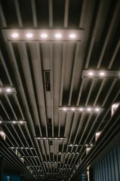 Striking architectural ceiling with repetitive linear structure and lighting Stock Photos