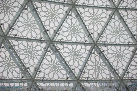 A striking architectural structure features a series of triangular patterns m Photos