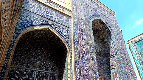 Striking blue tile facades of ancient Islamic mausoleums at Shah-i-Zinda Stock Footage 336807436