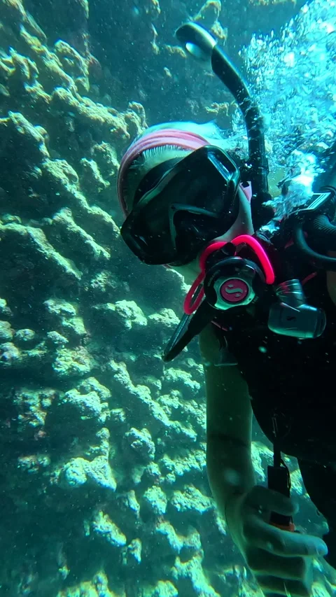 This striking close-up footage captures a diver in a mask Stock Footage 327445797