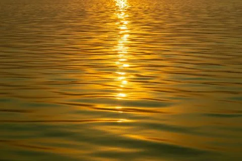 A striking close up of waters surface at sunset or sunrise Stock Photos