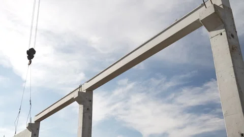 A striking concrete structure rises against a backdrop of clouds Stock Footage 314790861
