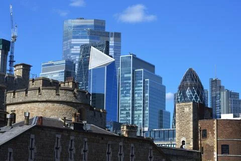 A striking contrast features ancient stone battlements of the historic castle Stock Photos