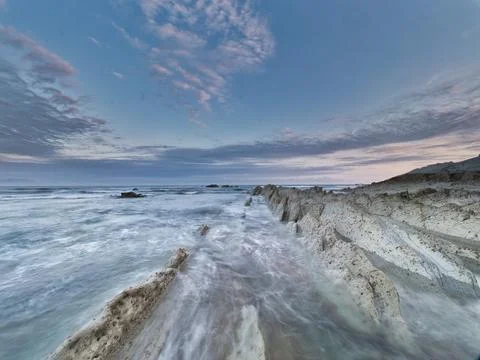 Striking Flysch Rock Path Leading to Ocean - Ultra-wide long exposure persp.. 스톡 사진