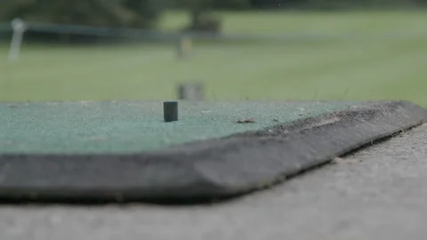 Striking a golf ball close up Stock Footage 237459348