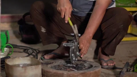 STRIKING IRON WITH A HAMMER Stock Footage 287329216