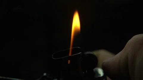 Striking A Lighter At Night Stock Footage 94366071