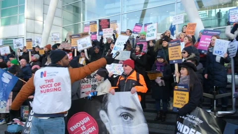 Striking nurses with placards, in protest of government cuts and unfair pay. Stock Footage 231612652