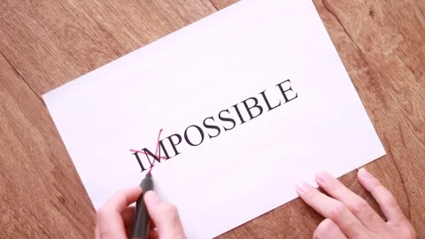 Striking out "im" prefix in "Impossible" inscription Vídeo Stock 95319190