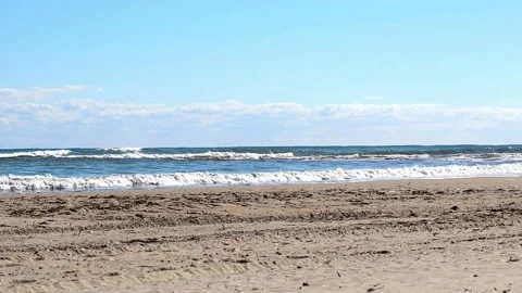 Striking scene of waves breaking on the sand of a Spanish beach Stock Footage 236711335