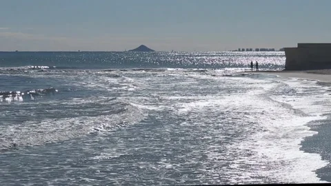 Striking scene of waves breaking on the sand of a Spanish beach Stock Footage 250405068