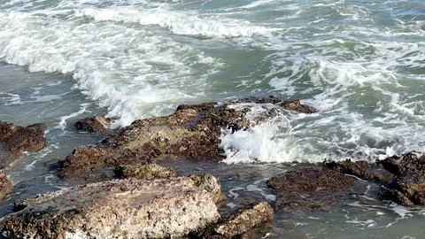 Striking scene of waves breaking on the sand of a Spanish beach Stock Footage 253864609