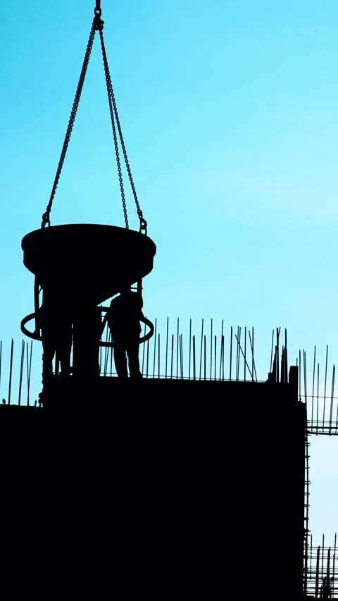 A striking silhouette of construction workers set against a vibrant sky Stock Footage 291710397