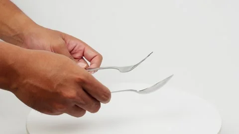 Striking Spoon and Fork Together Creating Sound Video stock 327848633