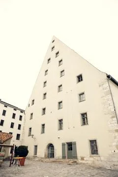 A striking triangular historic building with medieval architecture and multiple Stock Photos
