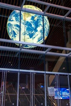 A striking view of a large illuminated globe display inside the Vancouver C.. Stock Photos