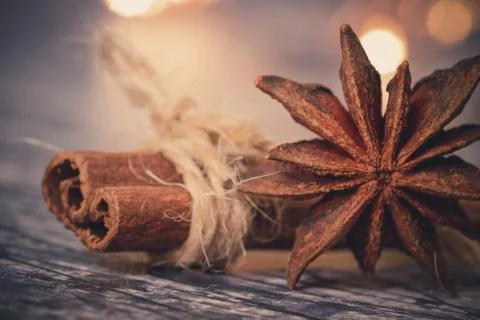 String around a cinnamon stick and star anise Stock Photos