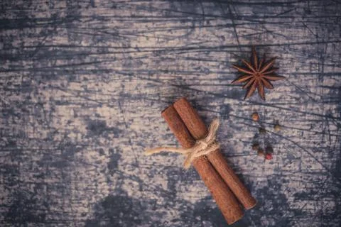 String around a cinnamon stick and star anise Stock Photos