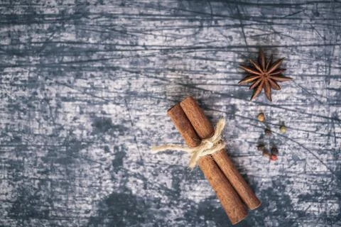String around a cinnamon stick and star anise Stock Photos