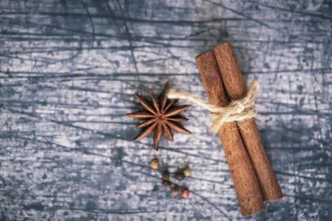 String around a cinnamon stick and star anise Stock Photos
