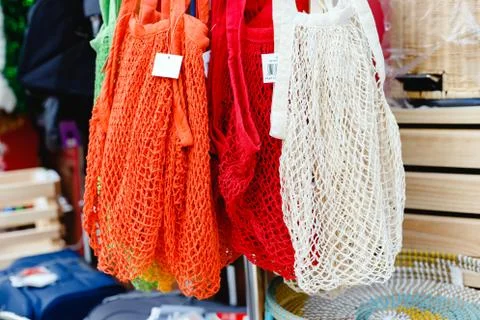 String bags. Store with many different colors string bags, basket. No plastic Stock Photos