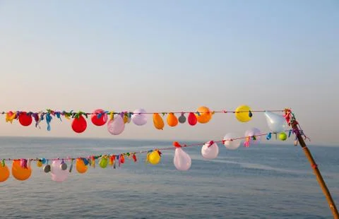 String of balloons floating in wind Foto stock