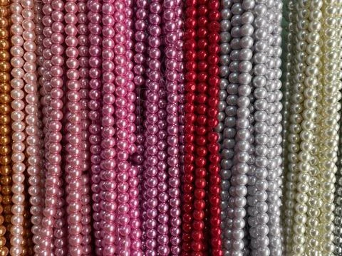 String of beads in various colors. yellow red, blue, green Stock Photos