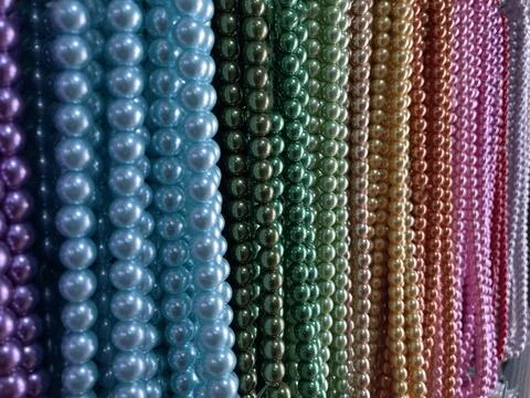 String of beads in various colors. yellow red, blue, green Stock Photos