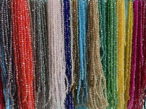 String of beads in various colors. yellow red, blue, green Fotos de archivo