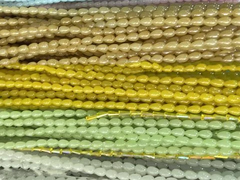 String of beads in various colors. yellow red, blue, green Stock Photos