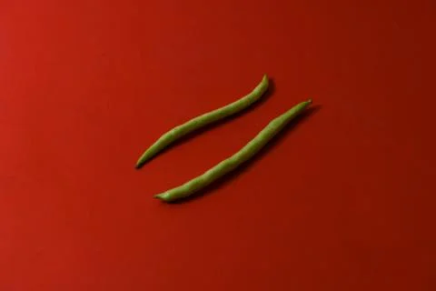 String beans fresh vegetables on isolated red background Stock Photos