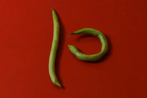 String beans fresh vegetables on isolated red background Stock Photos