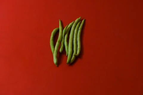 String beans fresh vegetables on isolated red background Stock Photos