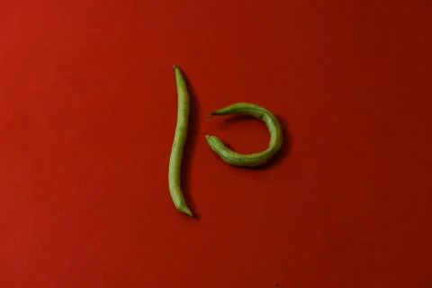 String beans fresh vegetables on isolated red background Stock Photos