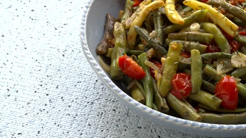 String beans sauted with tomatoes, onion, garlic and dried thyme. Stock Footage 284561768