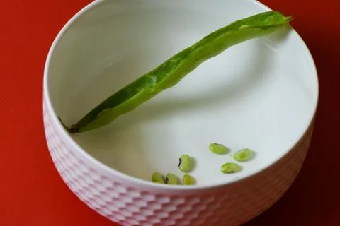 String beans seeds closeup on isolated red background Stock Photos