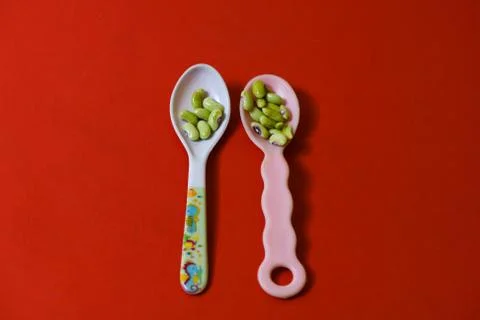 String beans seeds closeup on isolated red background Stock Photos