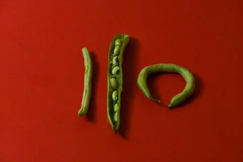 String beans seeds closeup on isolated red background Stock Photos