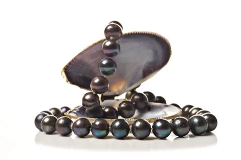 String of black pearls in a sea shell Stock Photos
