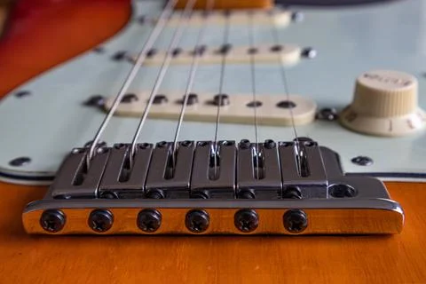 String bridge holder of an electric guitar Stock Photos