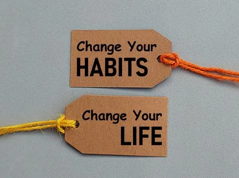 String card written change your habits, change your life Stock-Fotos