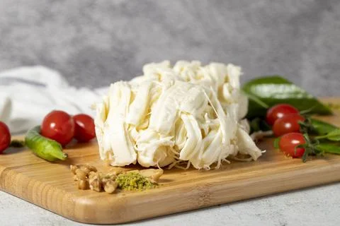 String cheese or Cecil cheese on a wood serving board. Dairy products Stock Photos