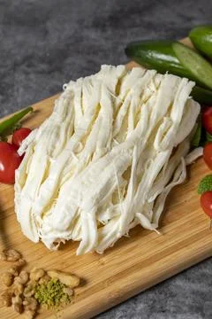 String cheese or Cecil cheese on a wood serving board. Dairy products Stock Photos