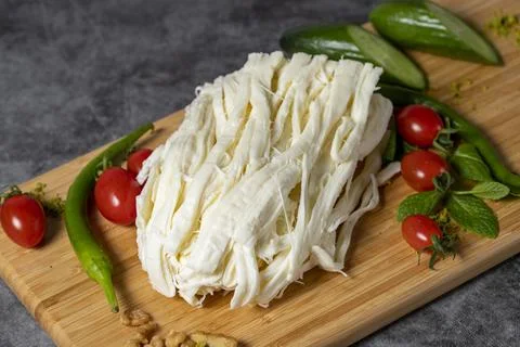 String cheese or Cecil cheese on a wood serving board. Dairy products Stock Photos