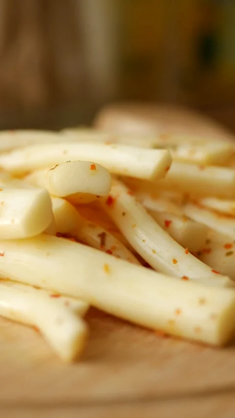 String cheese snack on a wooden board Stock Footage 320032874