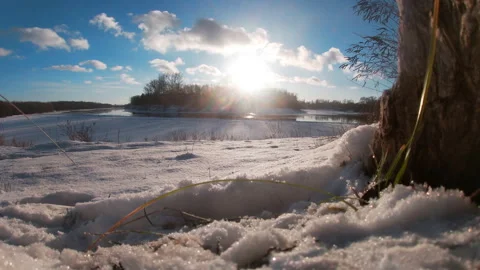 A string of clouds over a freezing river, landscape, snow, northern Ukraine. Stock Footage 325620335
